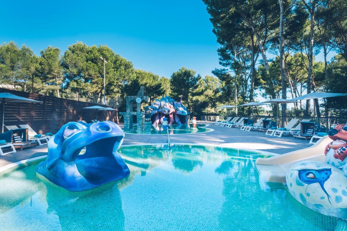 The kids' pool, with a small hippo-themed slide into the pool, at Iberostar® Pinos Park.