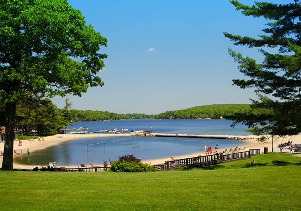 The beautiful swimming area at Lake Harmony, one of the best lakes for a family vacation within 4 hours of NYC.