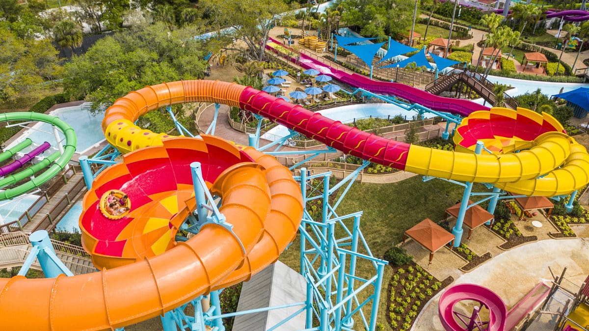 Riders shoot down a large water slide at Adventure Island, one of the best things to do in Tampa Bay with kids.