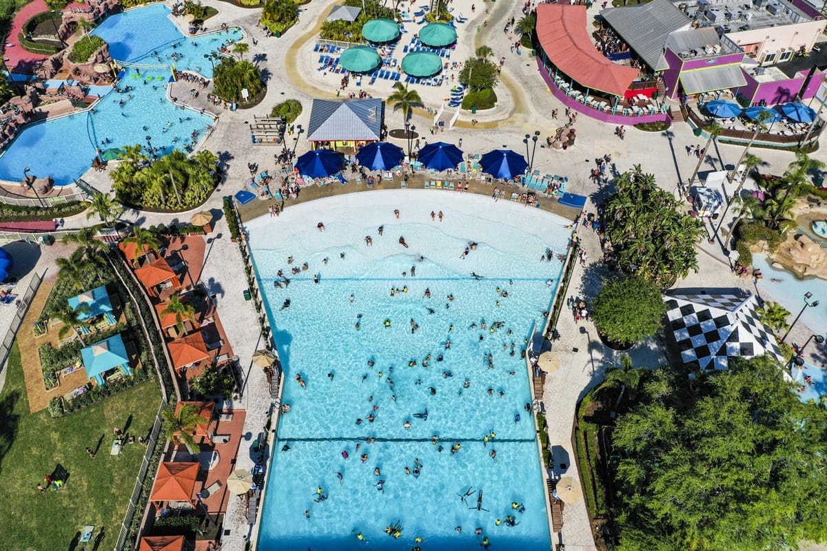 An aerial view of the Wave Pool at Adventure Island, filled with people on a sunny day.
