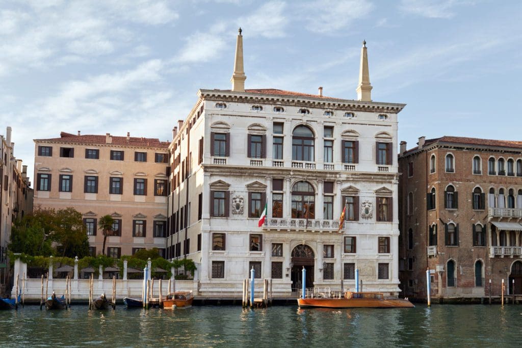 The exterior entrance to  Aman Venice along a canal.