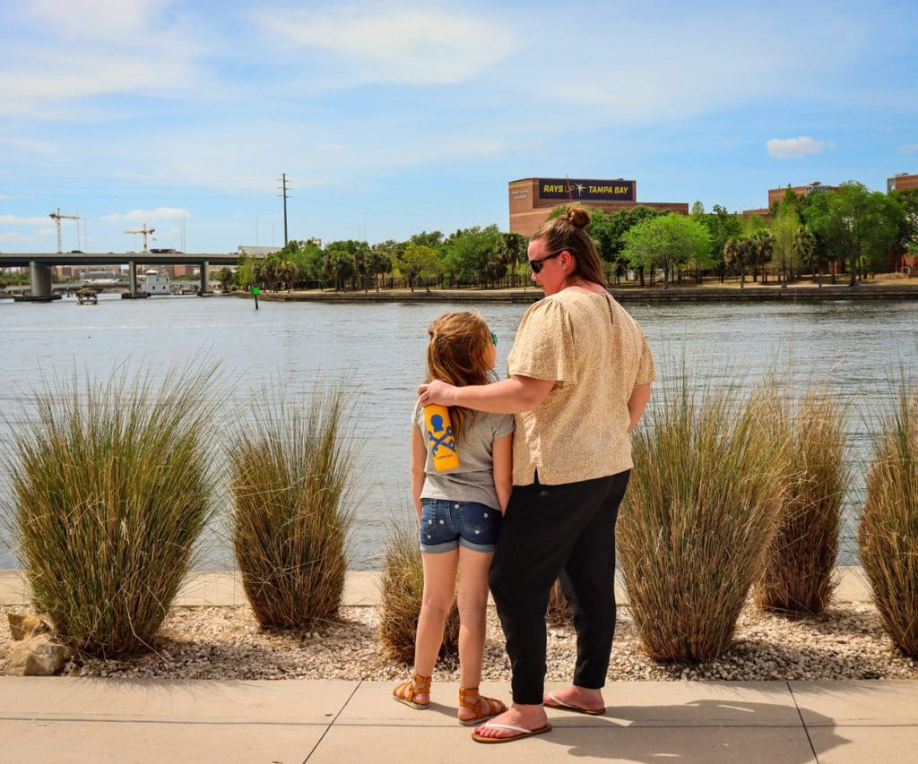 A young girl and her mom look out onto the Hillsborough River, while exploring Tampa Bay.