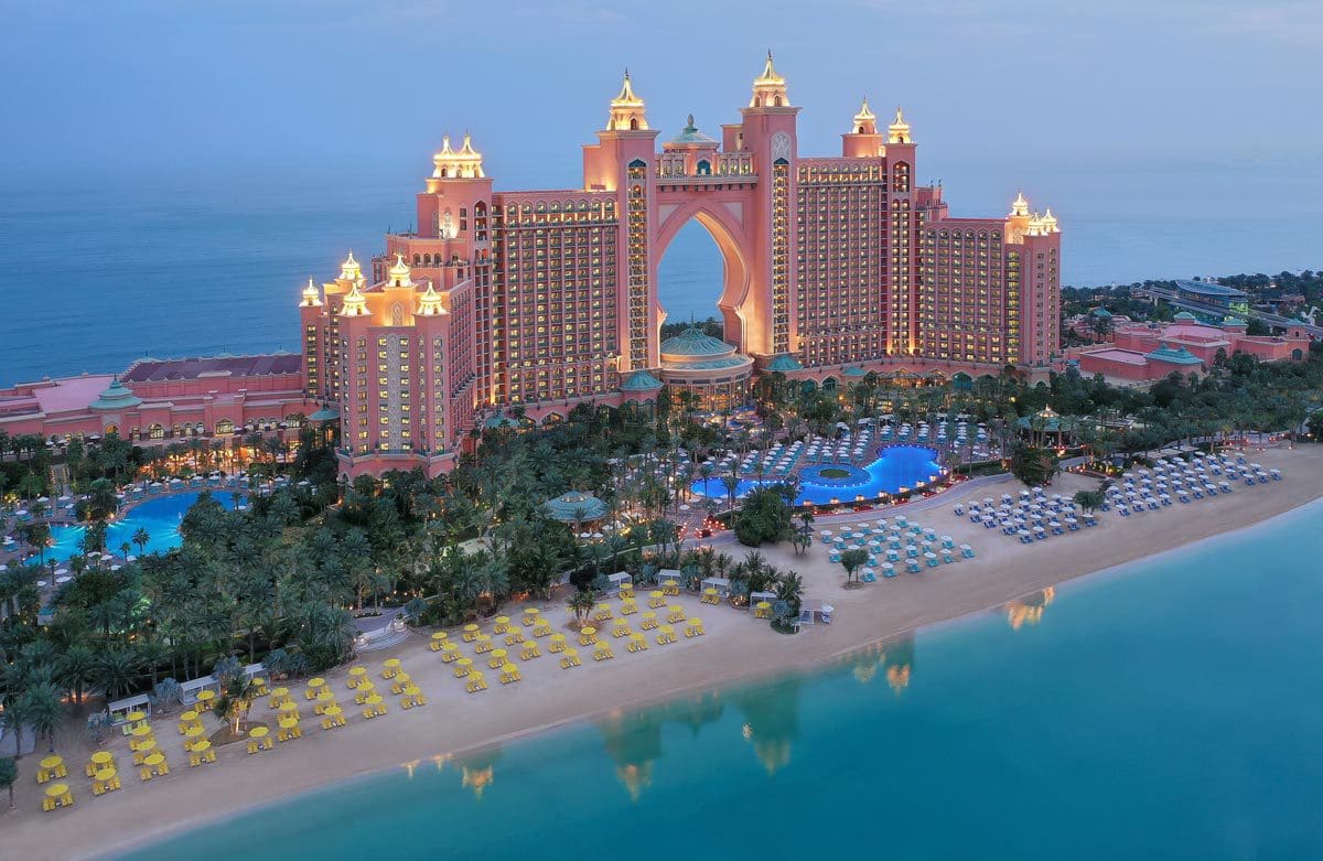 The large resort building of Atlantis, The Palm, one of the best beachfront hotels in Dubai for families, nestled along the sand.