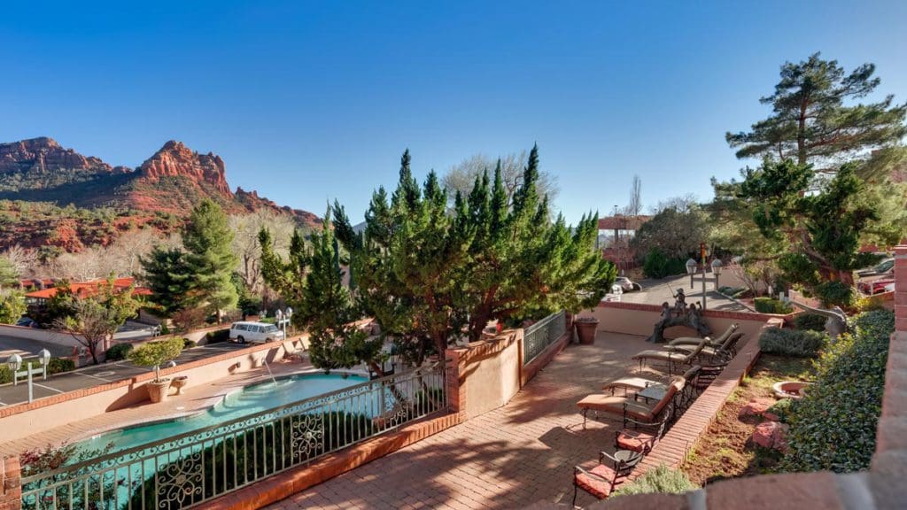 The outdoor pool and terrace patio at Best Western Plus Arroyo Roble Hotel & Creekside Villas, one of the best hotels in Sedona for families.