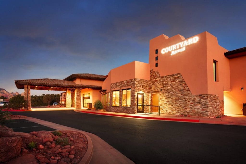 The exterior entrance to Courtyard Sedona by Marriott at night.