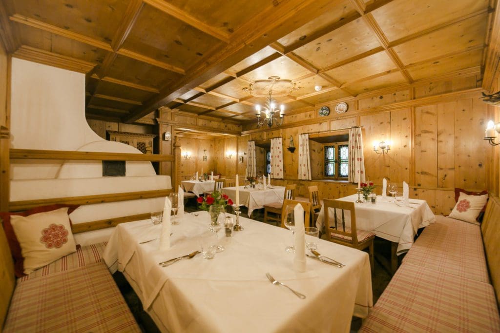 Inside the on-site dining room at Hotel Sailer, with alpine designs and rustic charm.