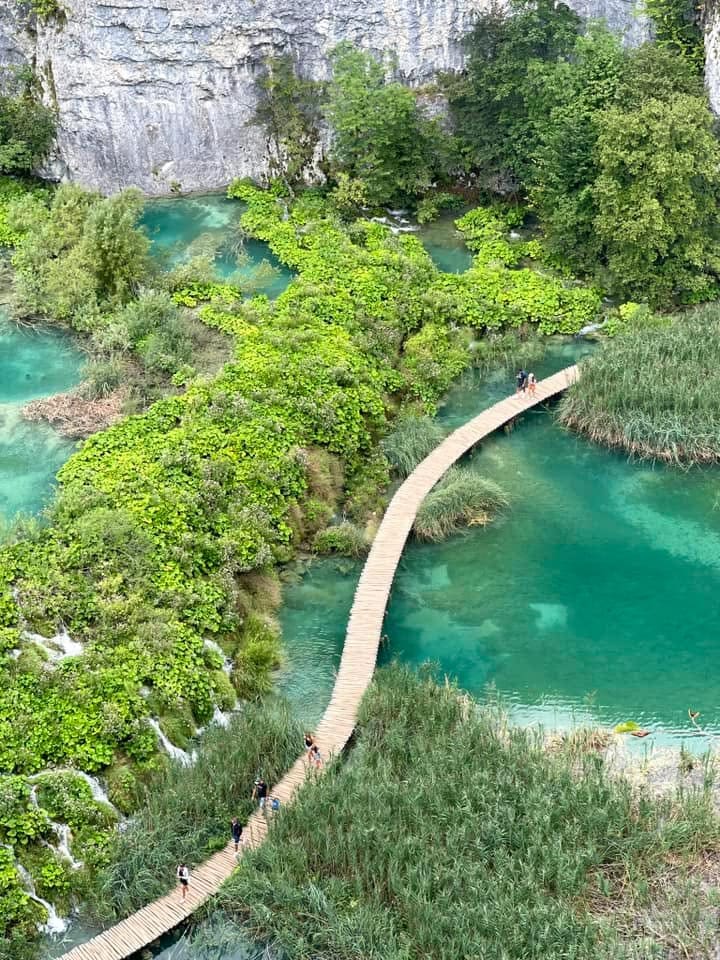 An aerial view of a boardwalk path in Plitvice Falls.