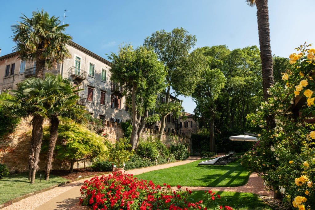 Lush garden on a sunny day at NH Collection Venezia Grand Hotel Palazzo dei Dogi.
