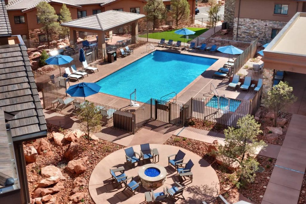 An aerial view of the pool and surrounding pool deck at Residence Inn By Marriott Sedona, one of the best hotels in Sedona for families.