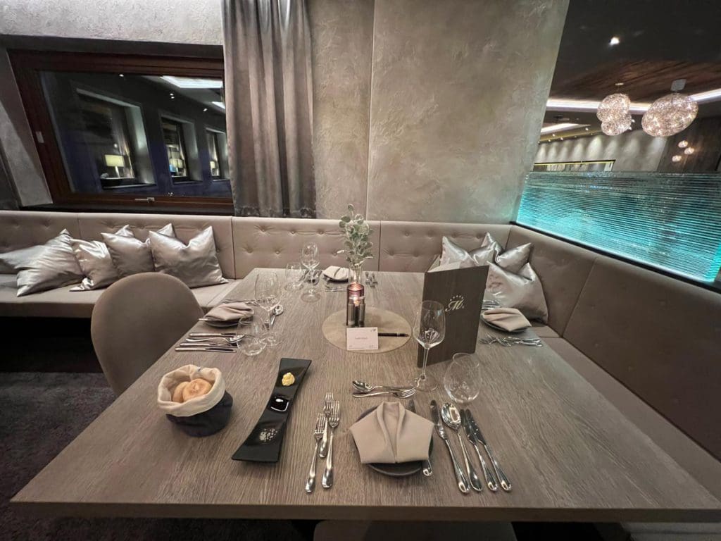 A set dining table for dinner at Hotel Mooshaus. Half-board inclusion is just one of the many reasons why families adore Hotel Mooshaus for a family ski vacation in Austria.