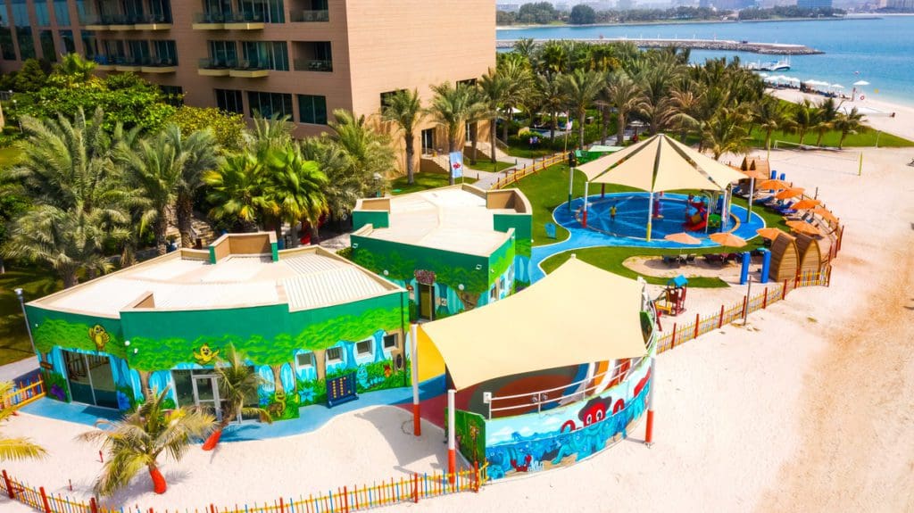 An aerial view of the vibrant kids' area at Rixos The Palm Hotel & Suites.