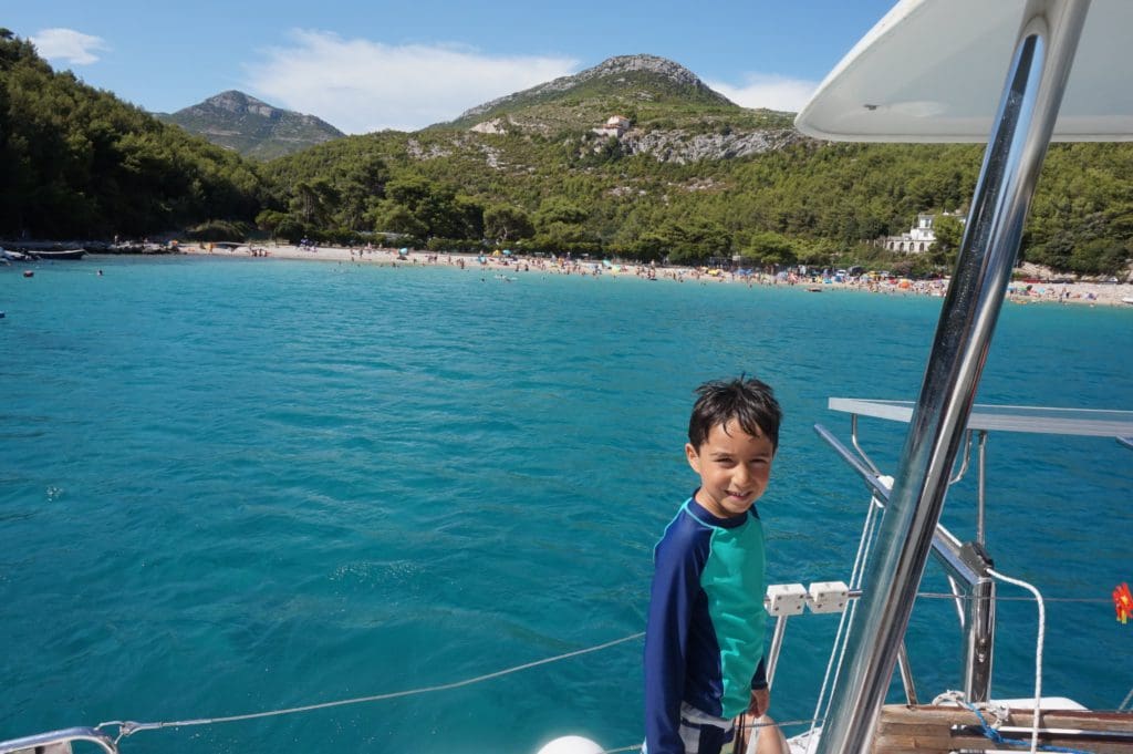 A young boy on a sail boat off the coast of Croatia.