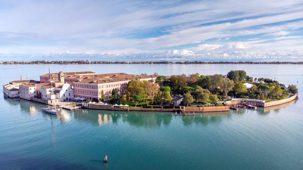 An aerial view of San Clemente Palace Kempinski Venice, nestled on an island, one of the best hotels in Venice for families.
