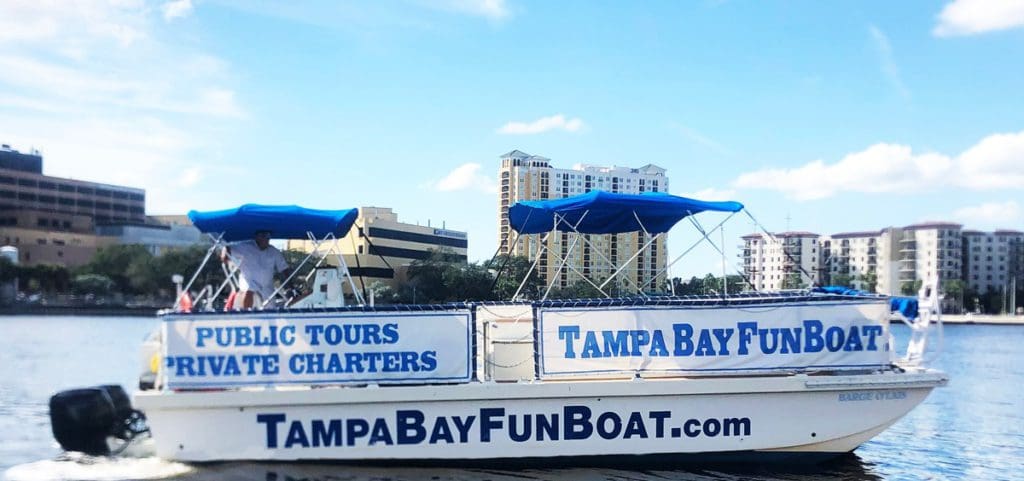 A Tampa Bay Fun Boat tour moves across the water off-shore from Tampa Bay.