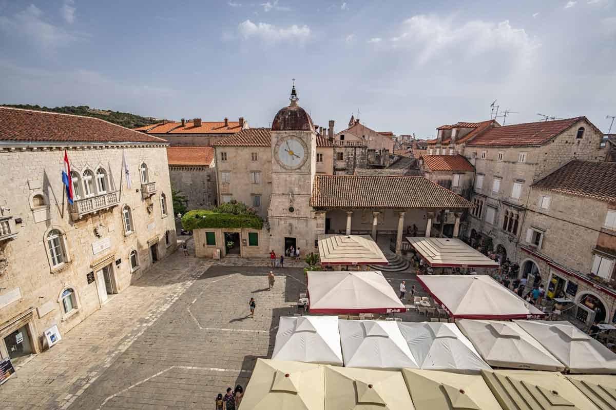 A aerial view of the historic Old Town square in Trogir, one of the best places to visit in Croatia with kids this summer.