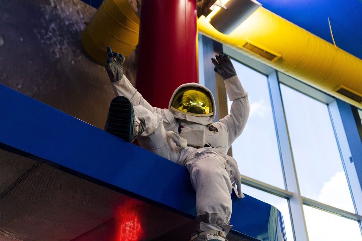 An toy astronaut hangs from the ceiling of MOSI, one the best things to do in Tampa Bay with kids.