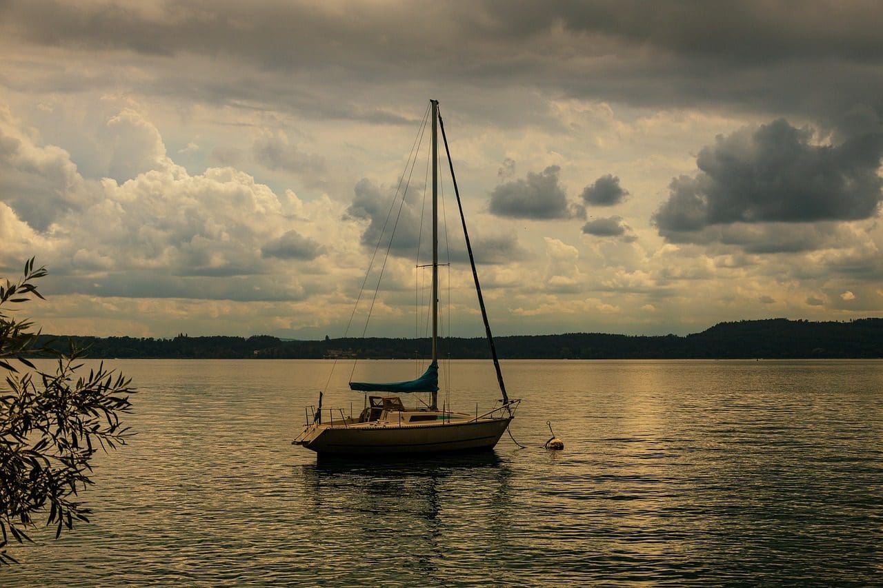 A sail boat tethered in the water on Seneca Lake.