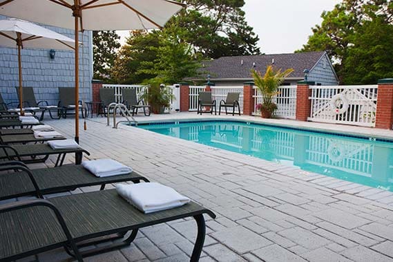 The outdoor pool and surrounding pool deck at the Bellmoor Inn and Spa.