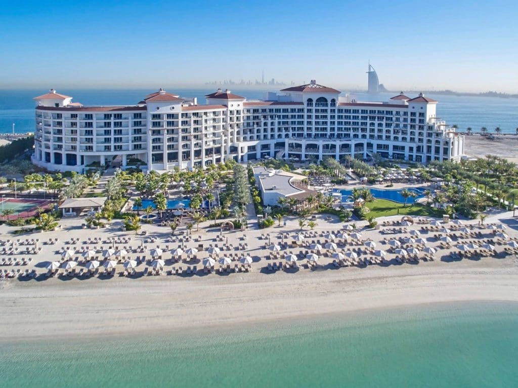 An exterior view of Waldorf Astoria Dubai Palm Jumeirah alone the beach in Dubai.