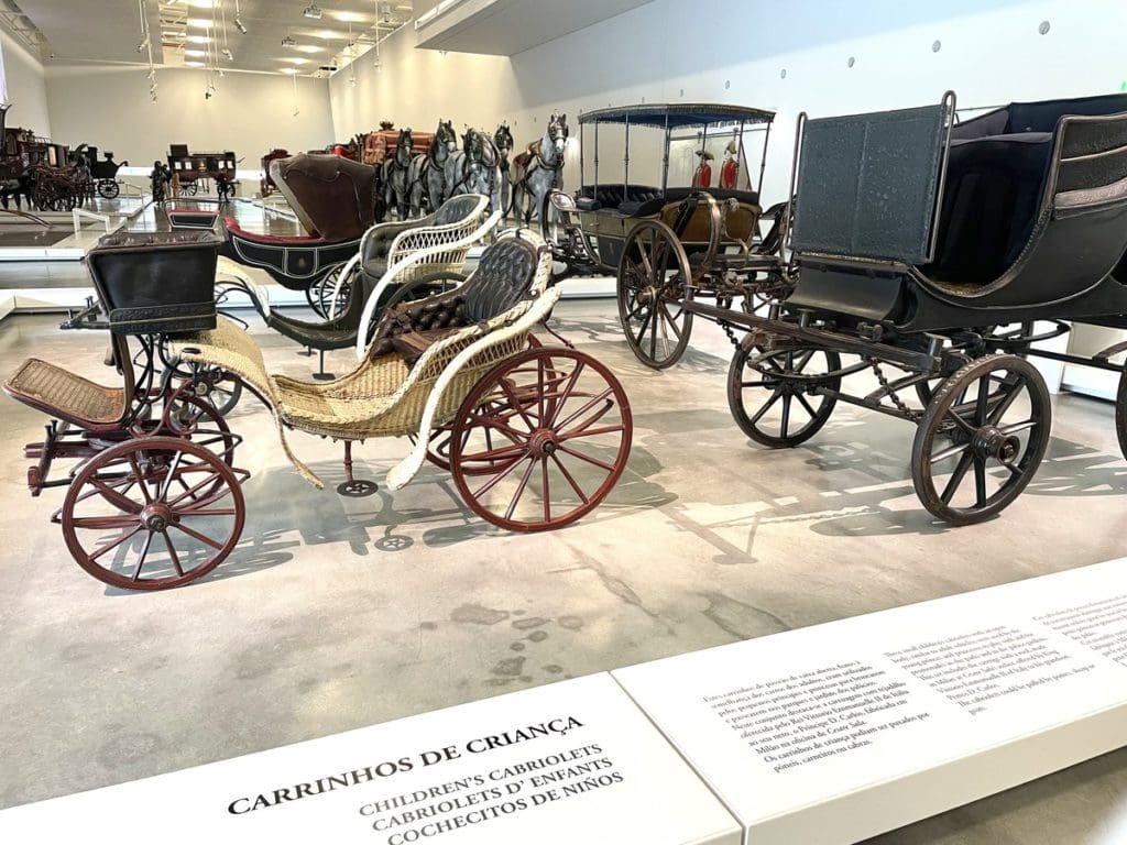 Inside a museum in Belem, featuring historic carriages, a fun stop on any Lisbon itinerary with kids.