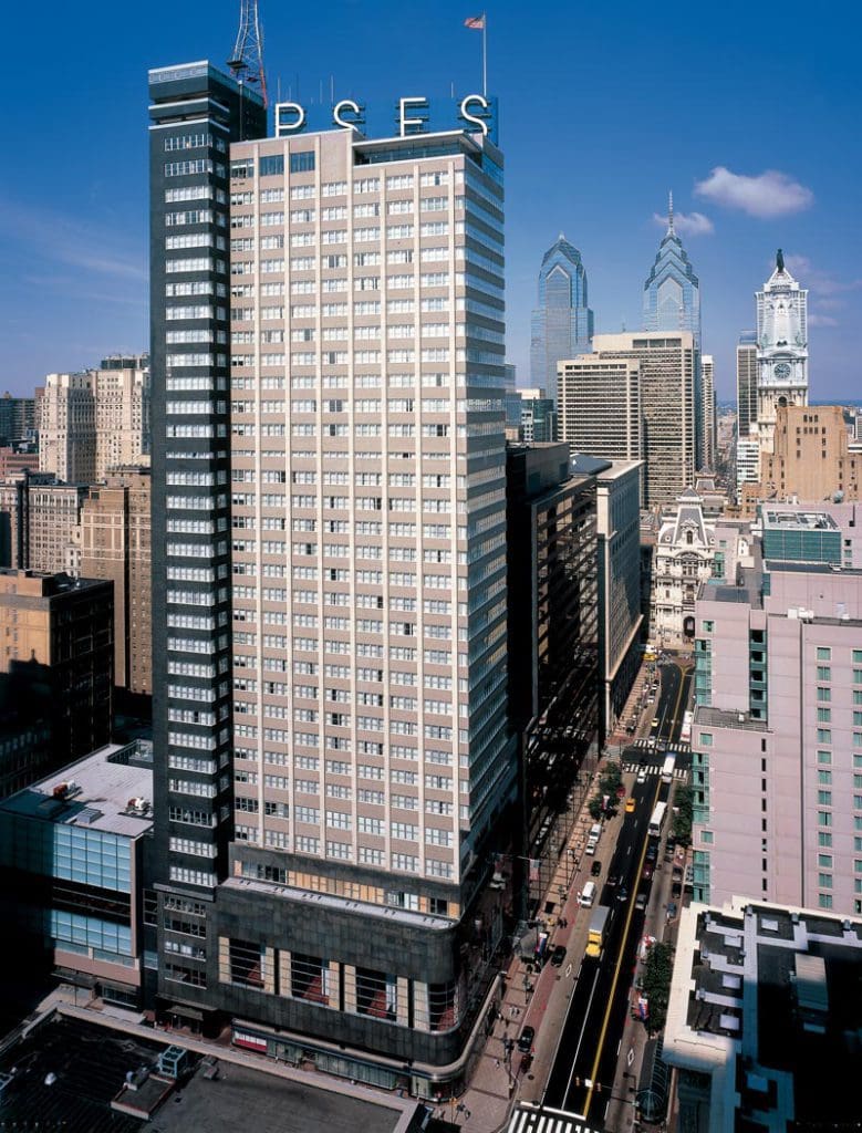The exterior of the high-rise Loews Philadelphia Hotel along the Philly skyline.