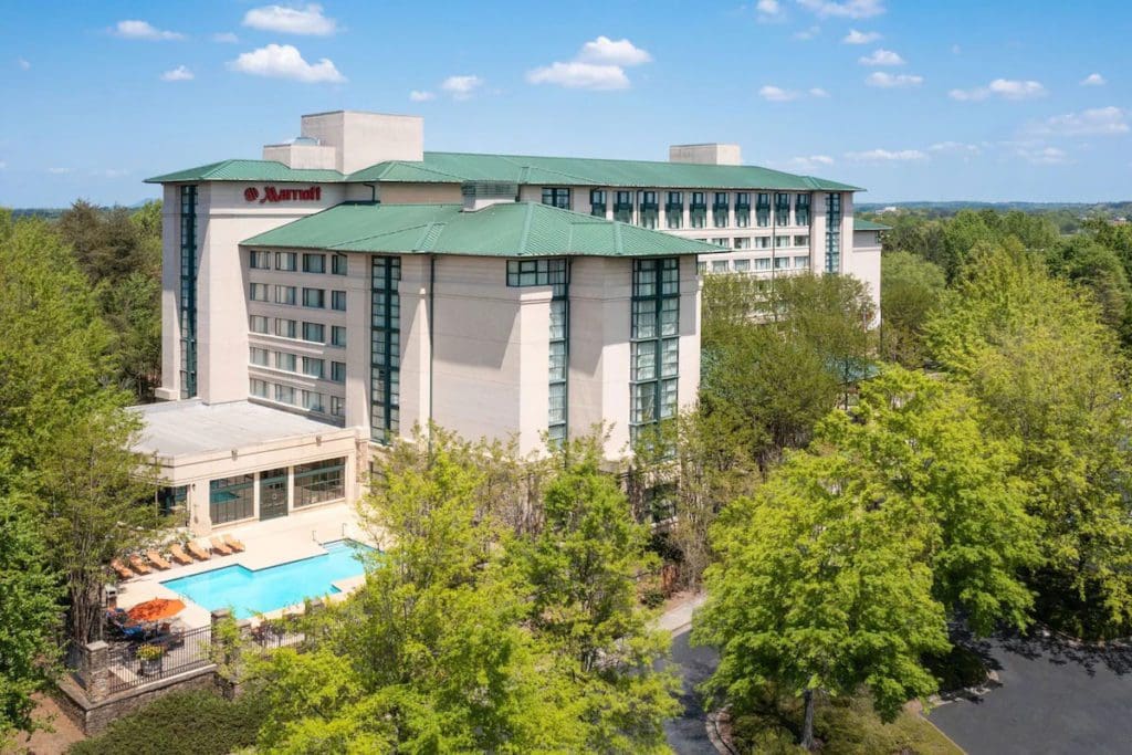 An exterior arial of Atlanta Marriott Alpharetta and the outdoor pool, one of the best hotels in Atlanta for families.