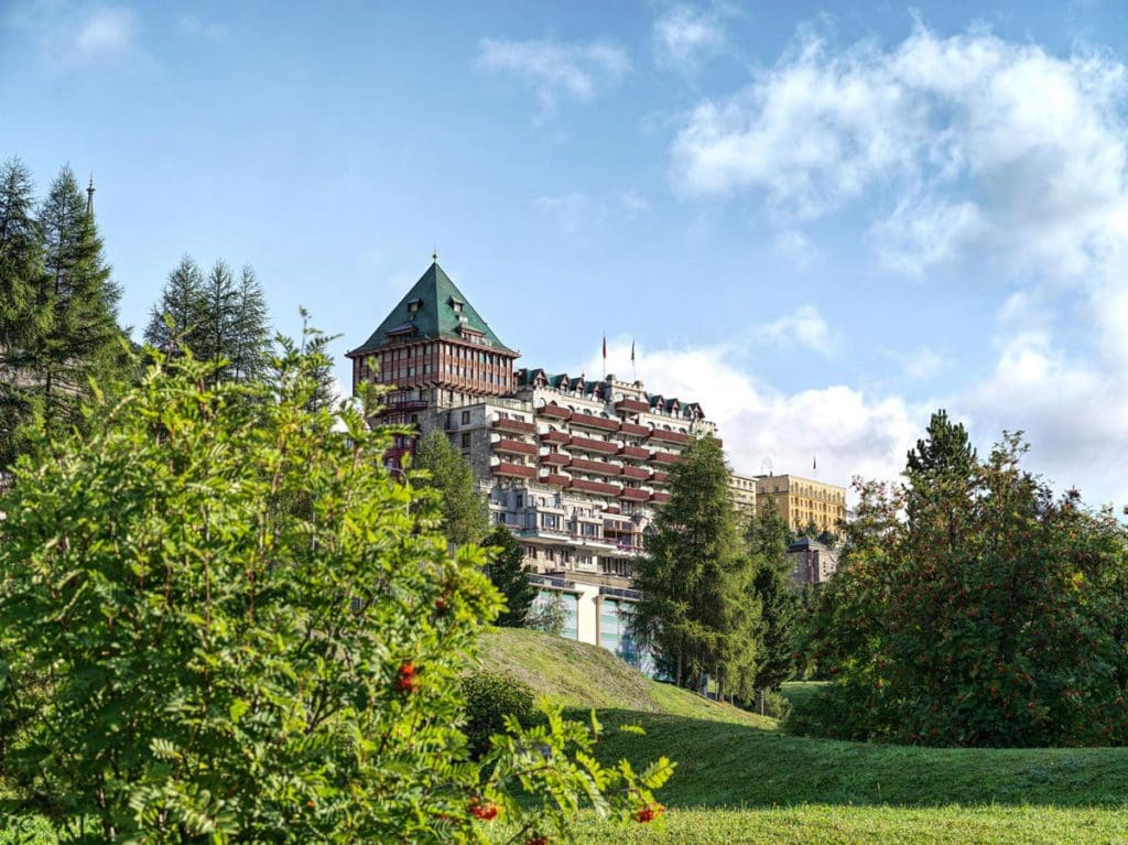 The exterior of Badrutt's Palace Hotel, one of the best hotels in St. Moritz for families.