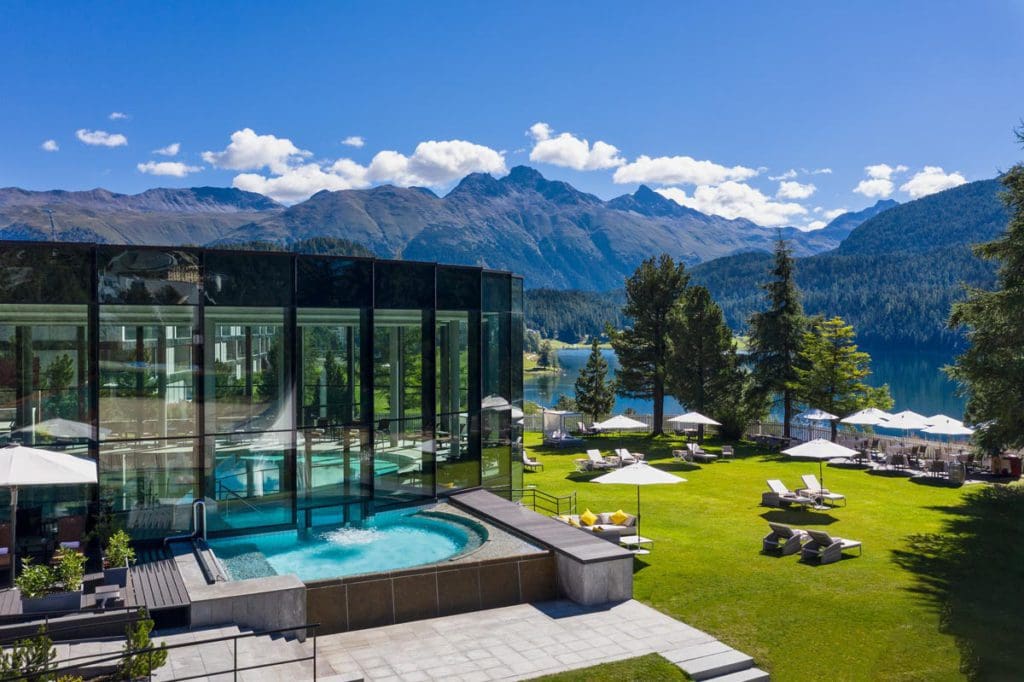 The lovely outdoor lawn and view of the mountains from Badrutt's Palace Hotel St. Moritz.