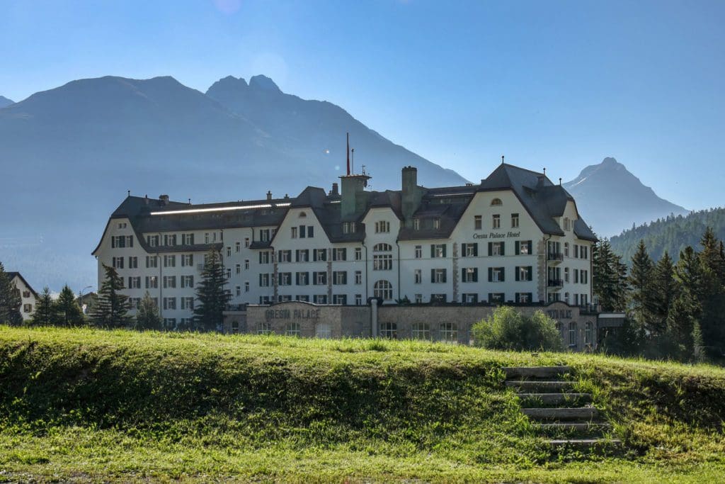 The exterior of Cresta Palace Hotel in the summer, one of the best hotels near St. Moritz for families.
