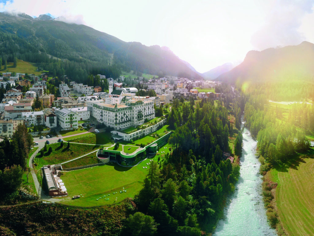 An aerial view of the hotel and grounds at Grand Hotel Kronenhof during the summer, one of the best hotels near St. Moritz for families.