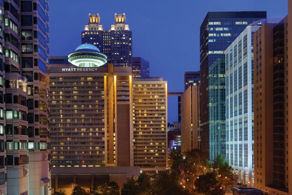 The exterior of Hyatt Regency Atlanta at night, one of the best hotels in Atlanta for families.