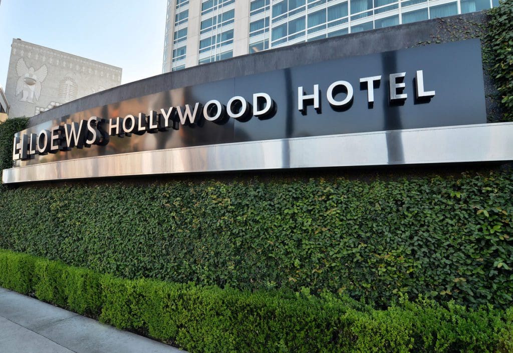 The entrance sign to Loews Hollywood Hotel, one of the best hotels in Los Angeles for families.