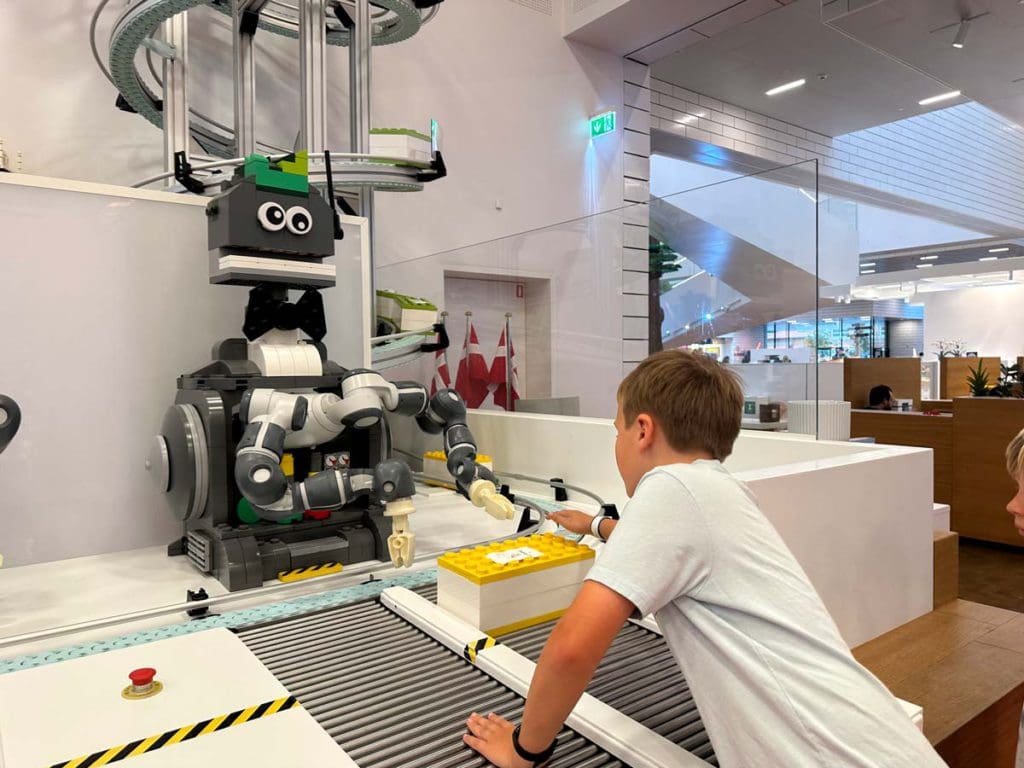 A young boy interacts with a mini chef experience at one of the dining facilities at LEGOLAND® Billund Resort.