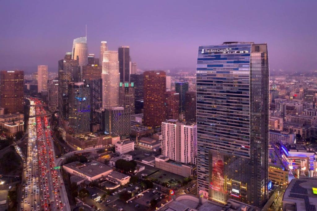 The exterior of The Ritz-Carlton, Los Angeles at dusk, one of the best hotels in Los Angeles for families.