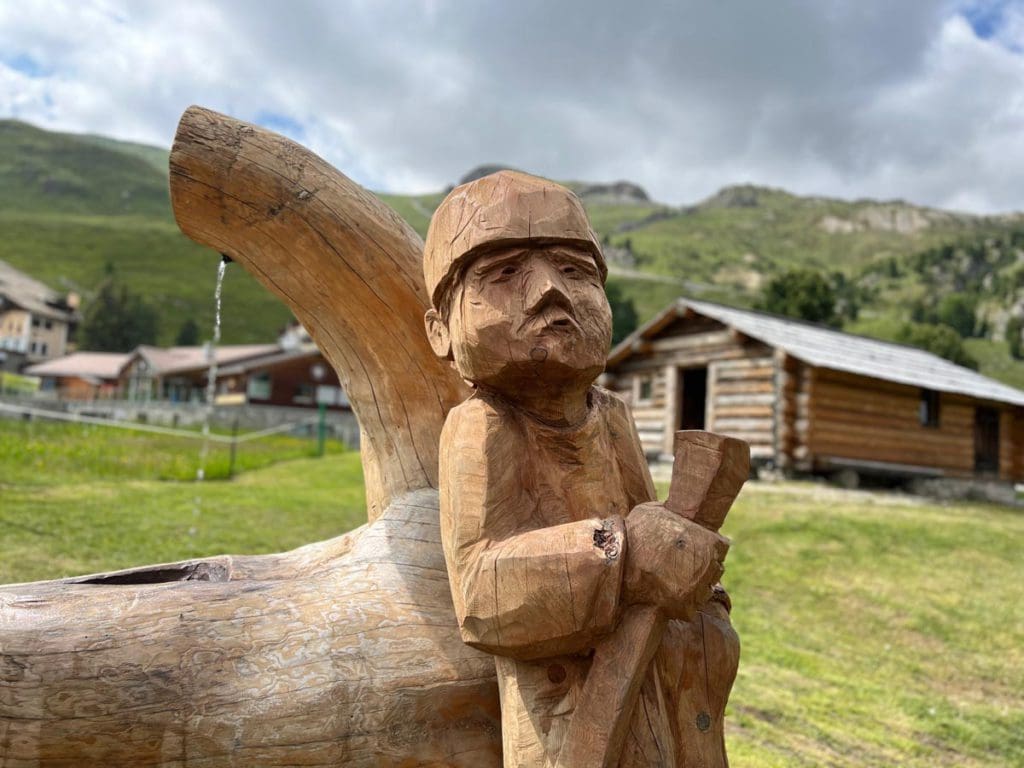 A wood carving near Heidi's House, as seen on one of the best hikes in St. Moritz with kids.