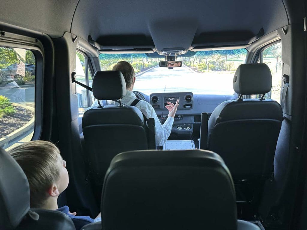 A family in their car, driving to Nemacolin Resort, a family resort in Pennsylvania your family will love.