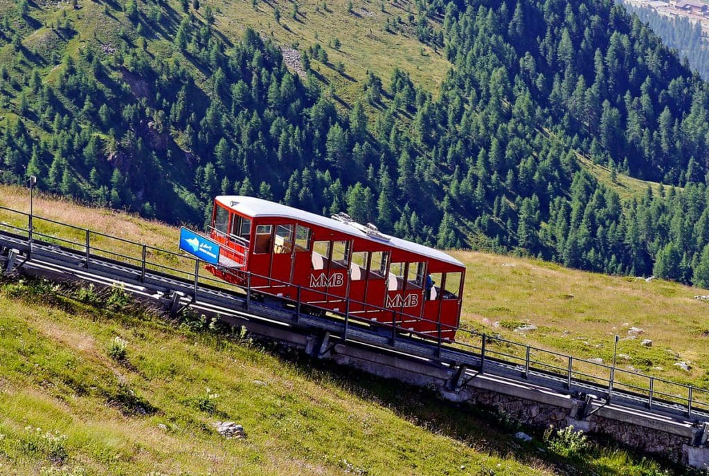A funicular carriage for Muottas Muragl moves down the tracks.