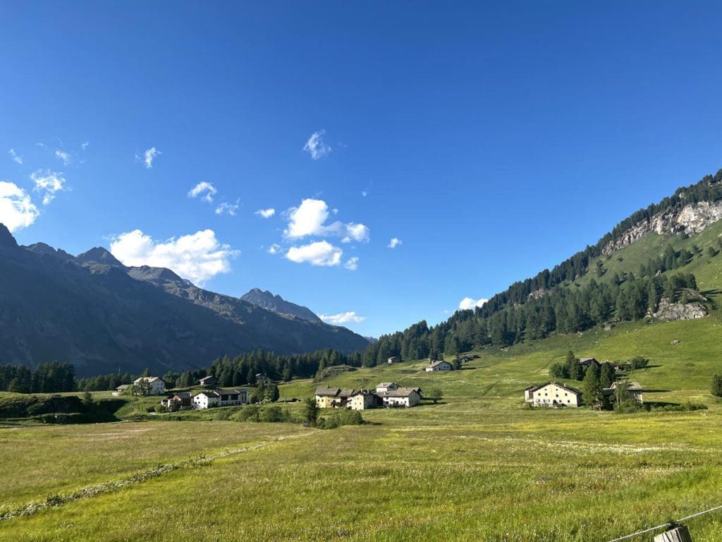 A scenic view of the Val Fex Valley on a sunny day.