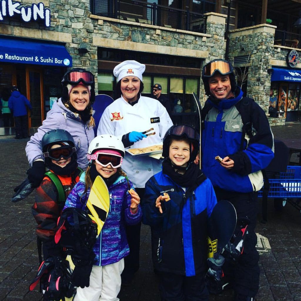 A family of five enjoys special cookies served in the NorthStar Resort village.