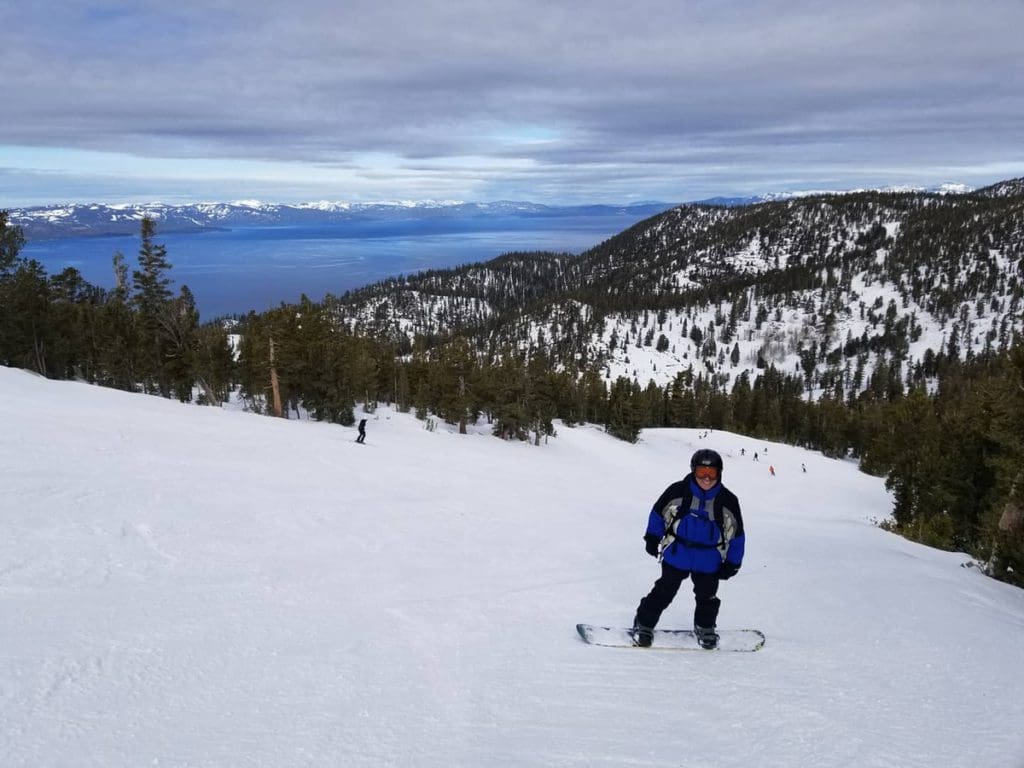 A man snowboards down a run at Heavenly Resort.