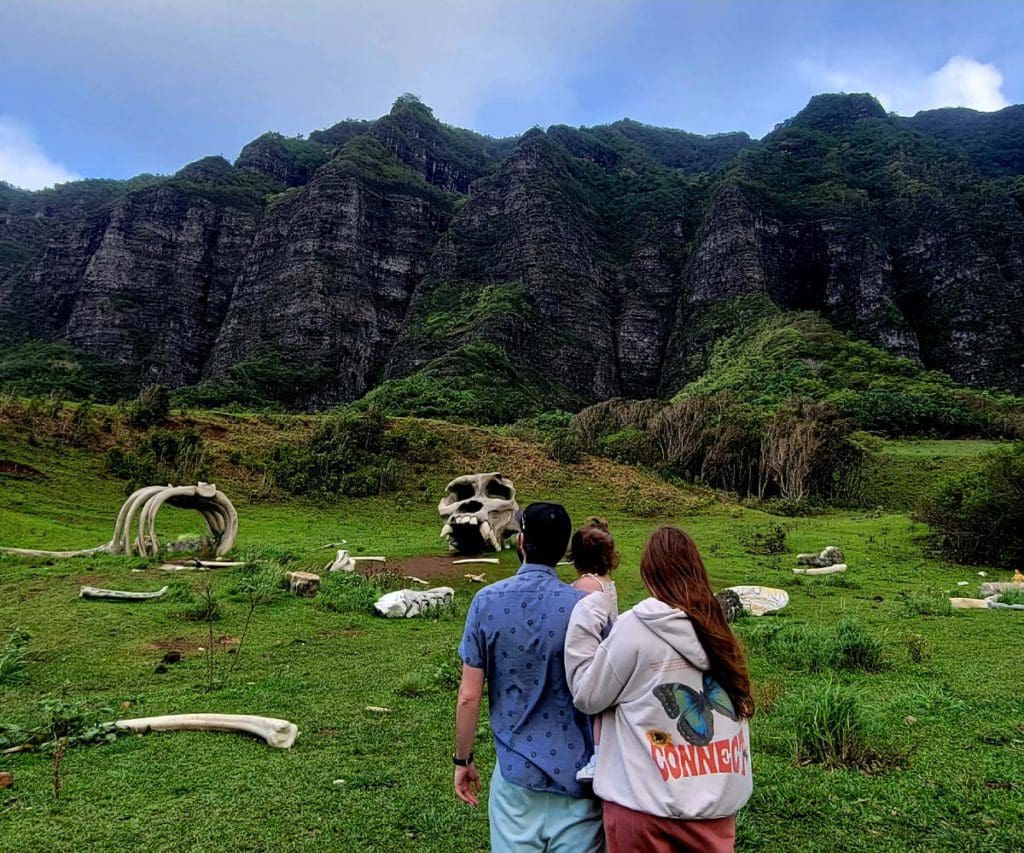 A family looks at stated "dinosaur bones" at Kualoa Ranch & Private Nature Reserve.