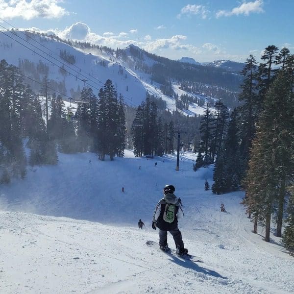 A young boy skiing down a run at SugarBowl in Lake Tahoe.