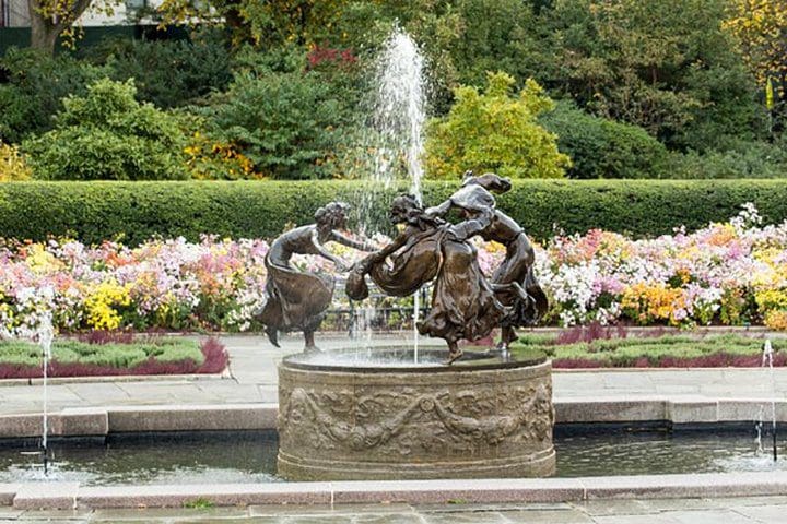 A beautiful garden and fountain, as seen on the Central Park Walking Tour.