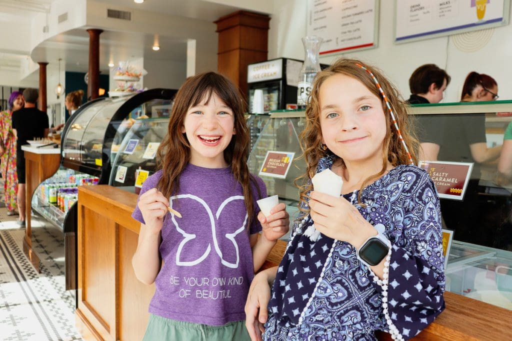 Two kids enjoy ice cream cones at Eiskaffee.