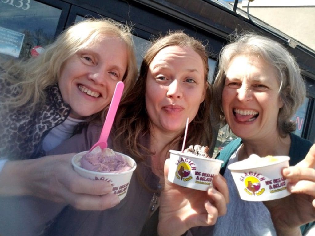 Three women enjoy ice cream dishes from Glacier Homemade Ice Cream & Gelato.