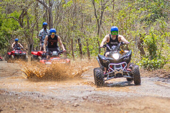 A tour of ATVers moves along a trail on the Private ATV or Buggy Tour from Tamarindo/Conchal & More tour.