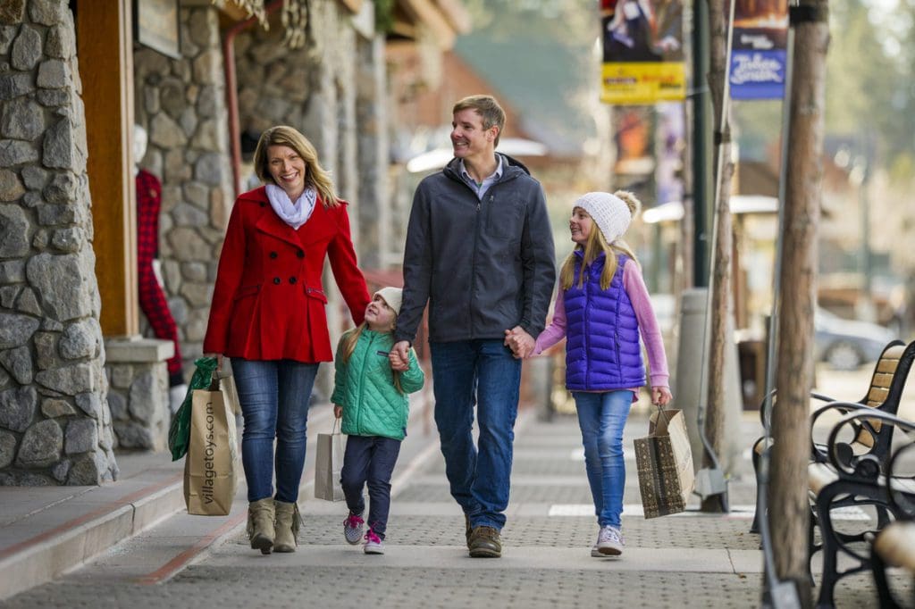 A family of four goes shopping in the village for Heavenly Resort.