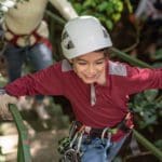 A young boy enjoys a zip-line experience in Costa Rica.
