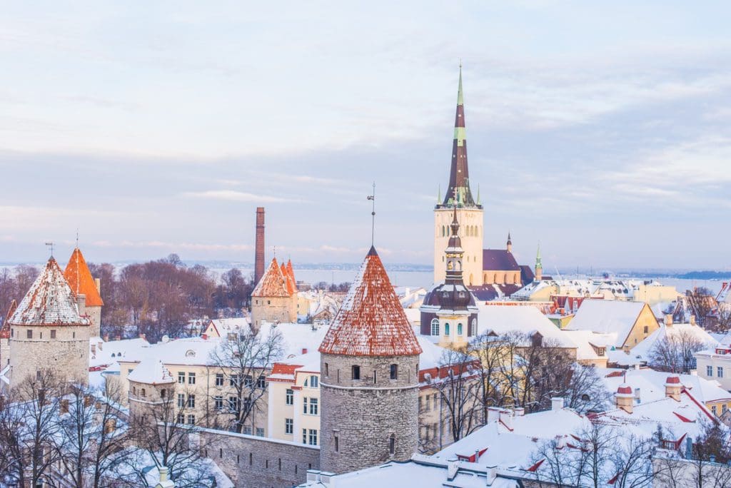 An aerial view of Tallinn dusted with snow, one of the best destinations for New Year's with kids.