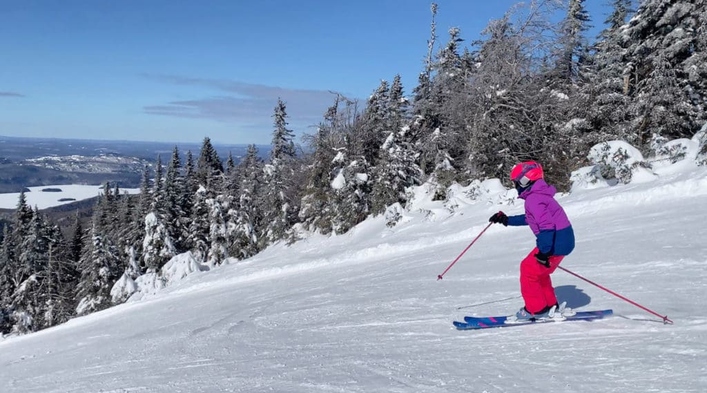 A young child skiing at Mont-Tremblant Ski School in Canada